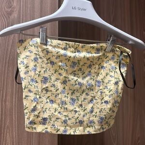 Forever 21 pale yellow tube top with blue floral with tags attached